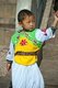 China: Young Naxi boy, Lijiang Old Town, Yunnan Province
